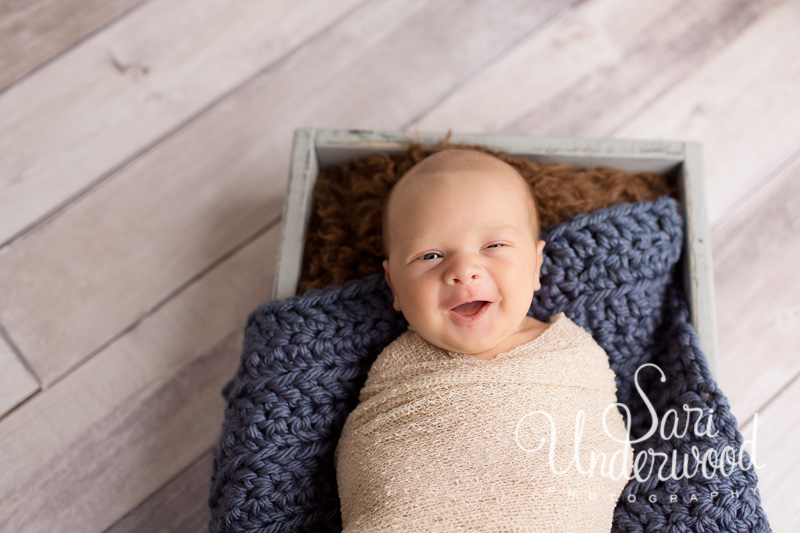 smiling newborn baby boy at 11 days old