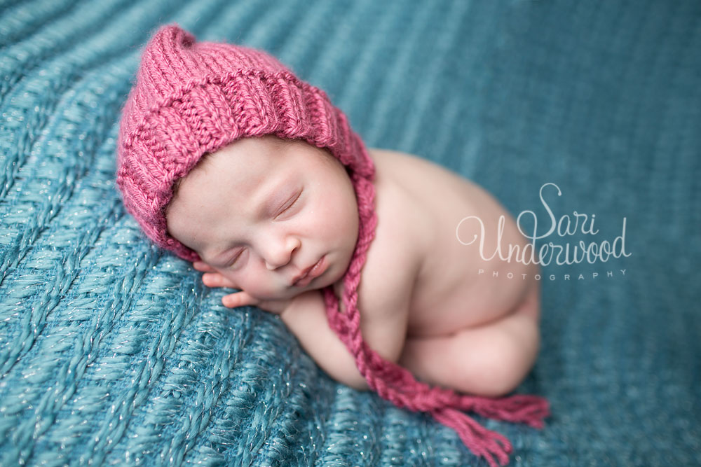 modern newborn portrait of baby girl in bold colors