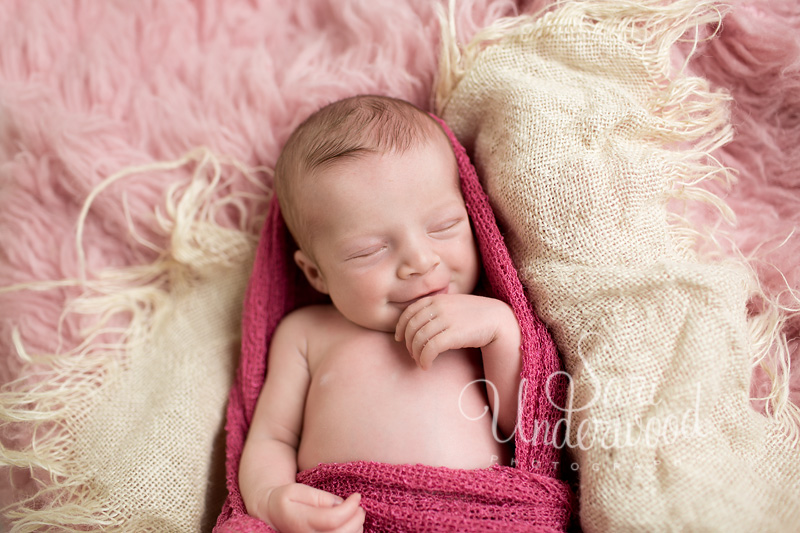 10 day old baby girl smiling