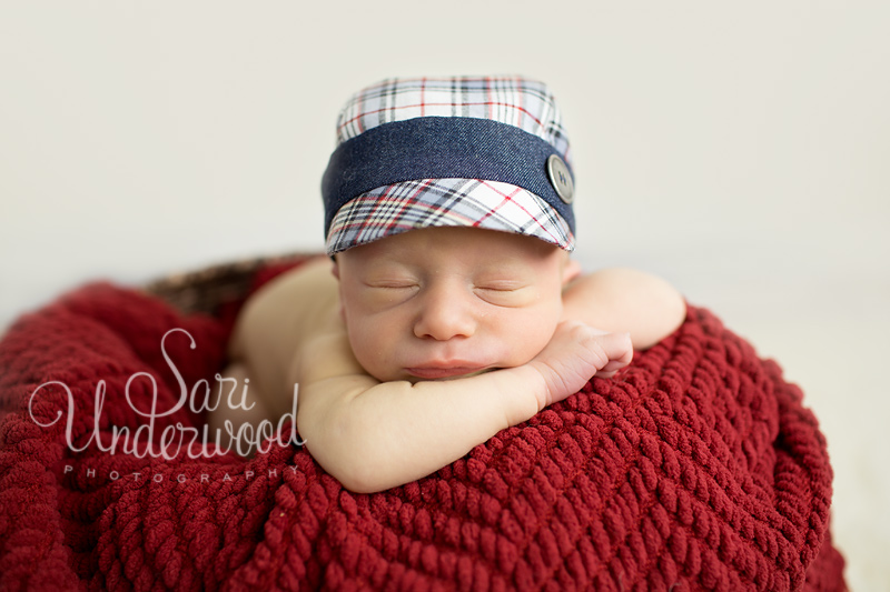sweet newborn baby boy in red, white and blue