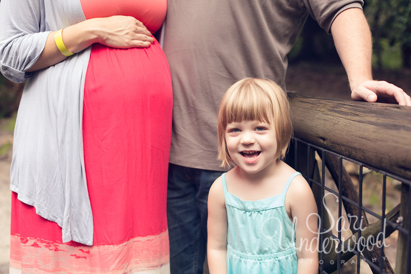 a family of 3 during their maternity portrait session