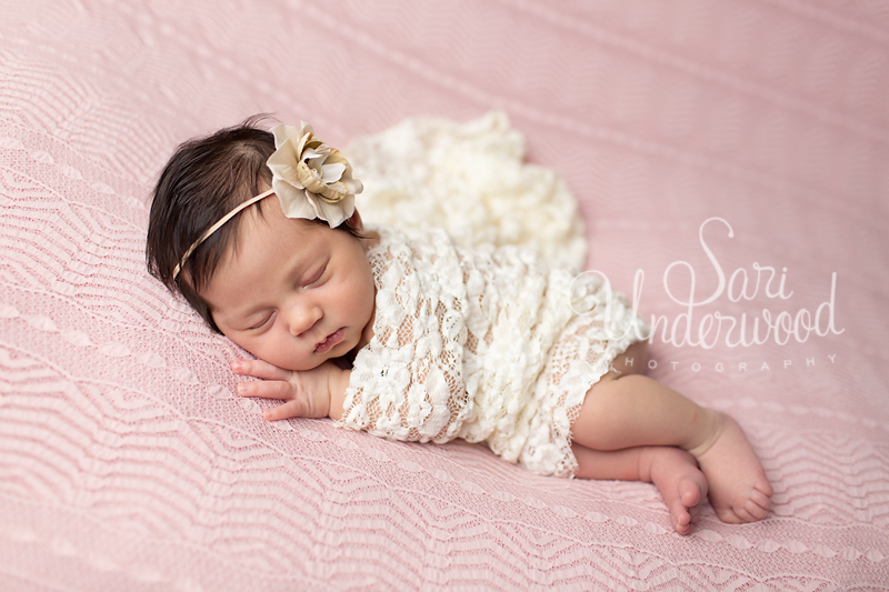 beautiful baby girl in pink and lace at 12 days old.