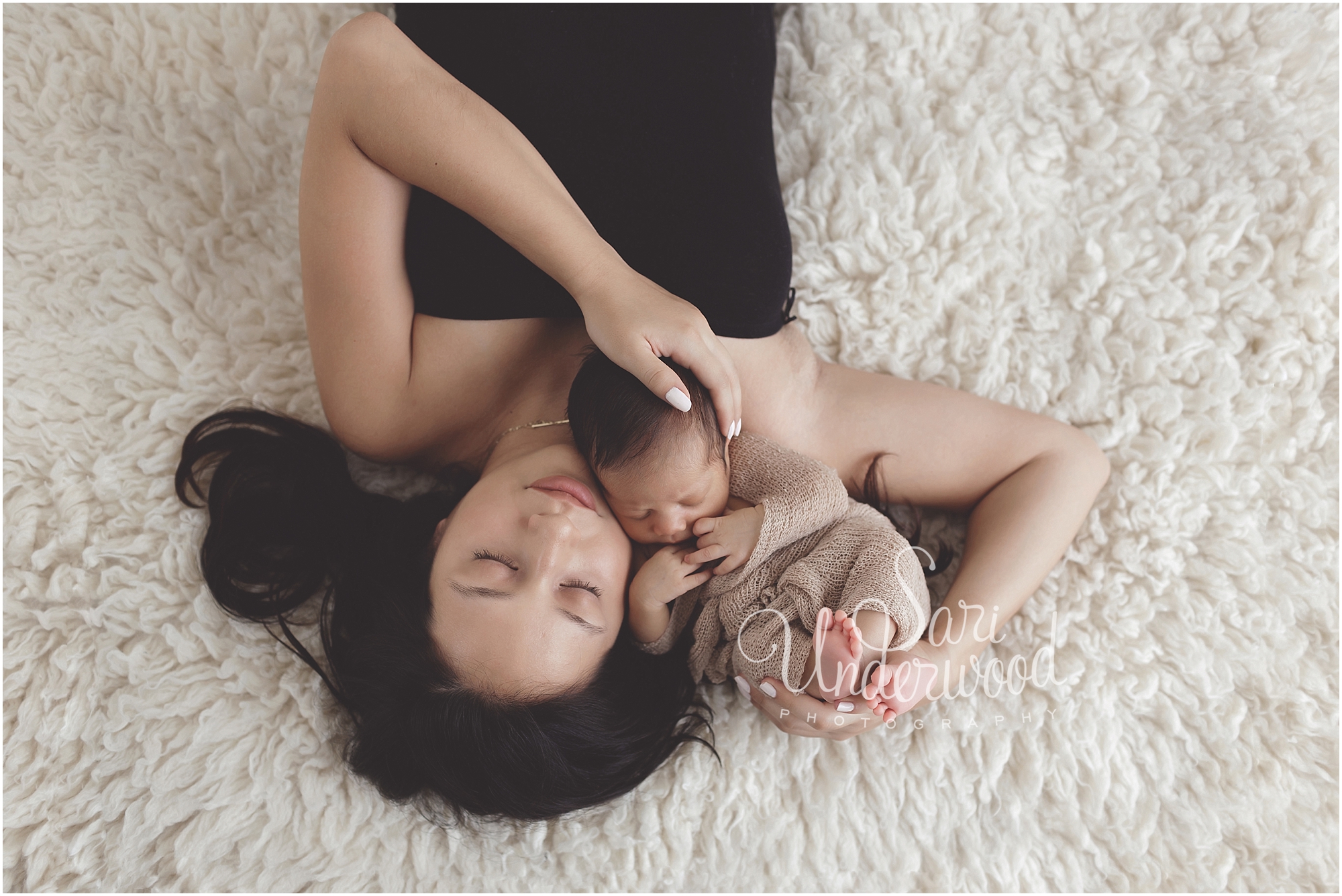 Month old baby boy posed sweetly with mom