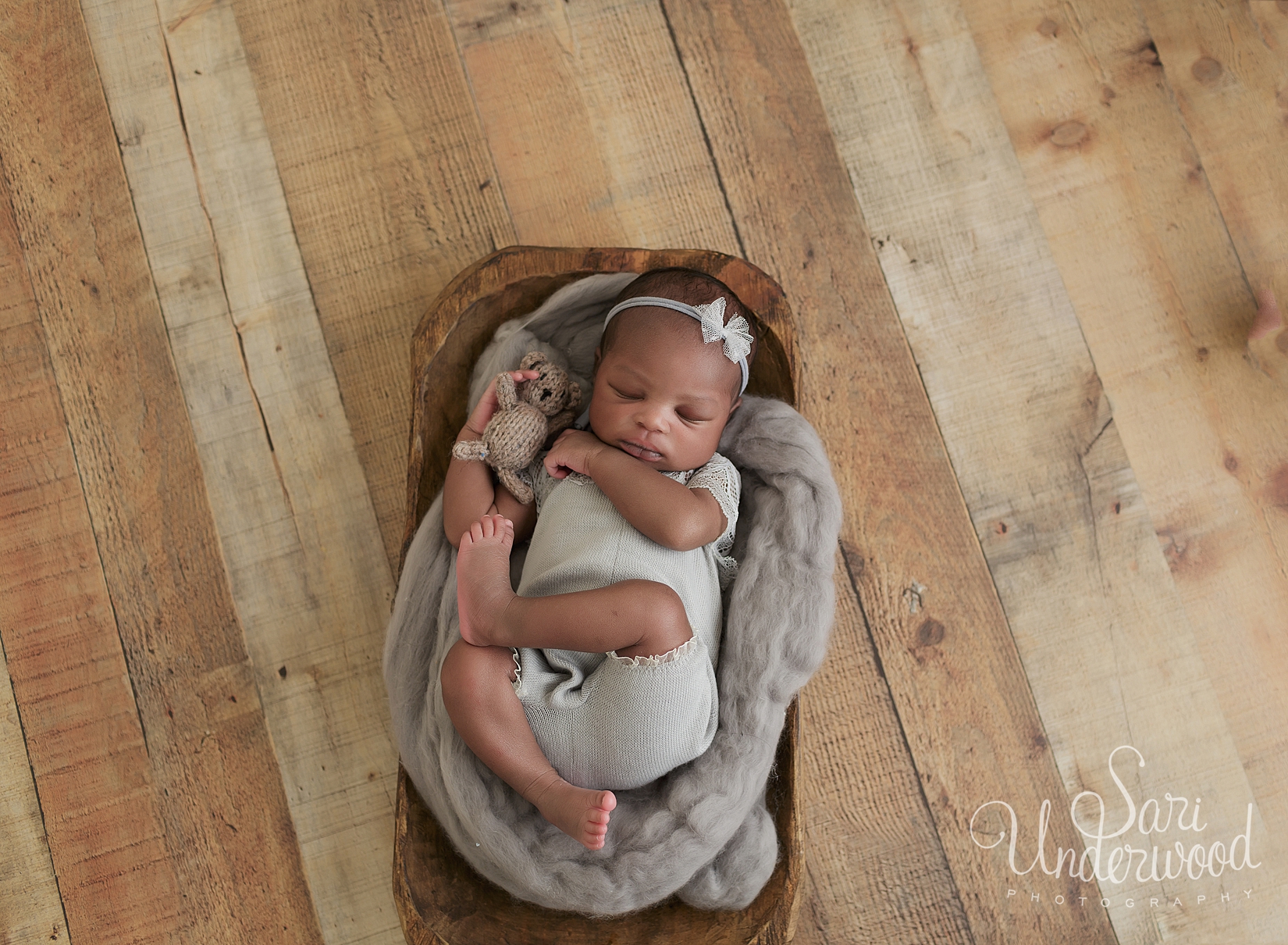 african american newborn girl posed in prop