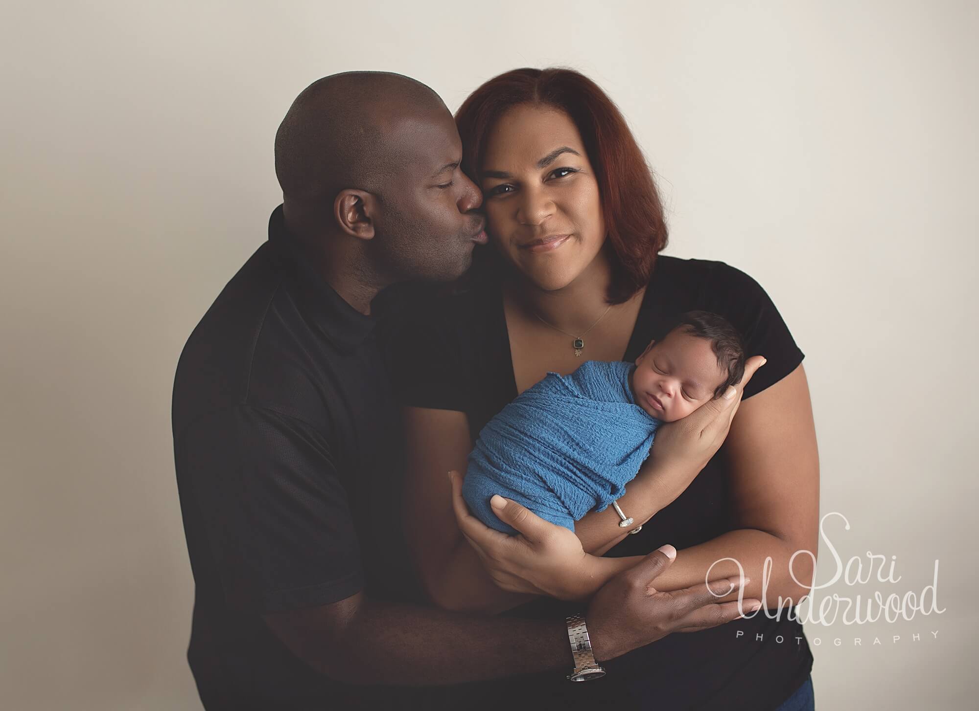 african american parents with newborn baby boy