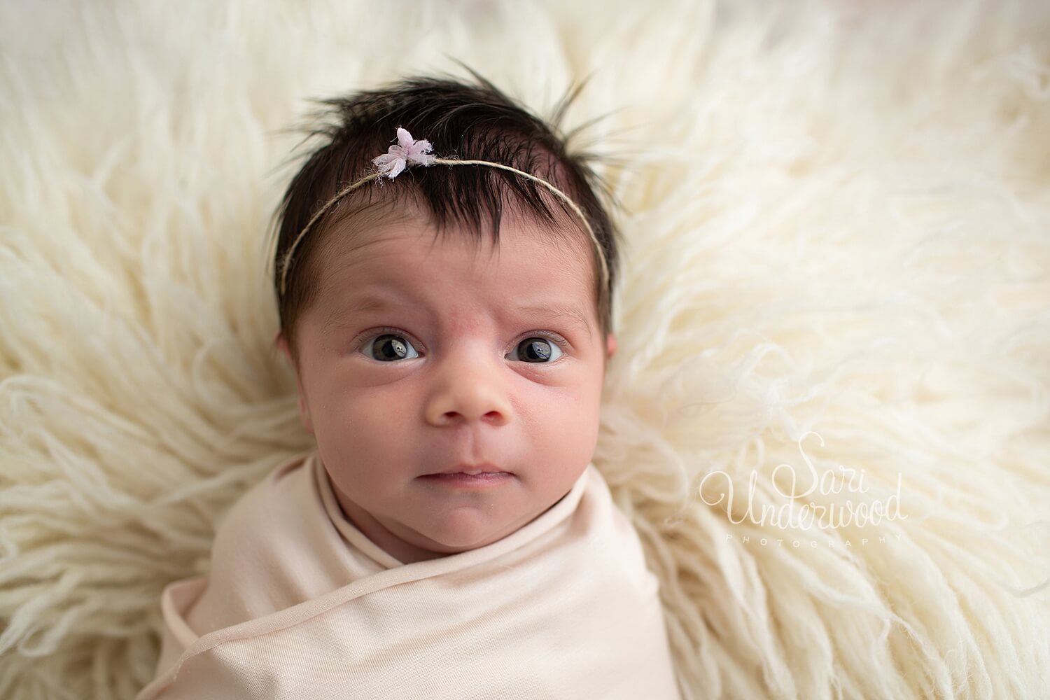 wide awake newborn baby girl 