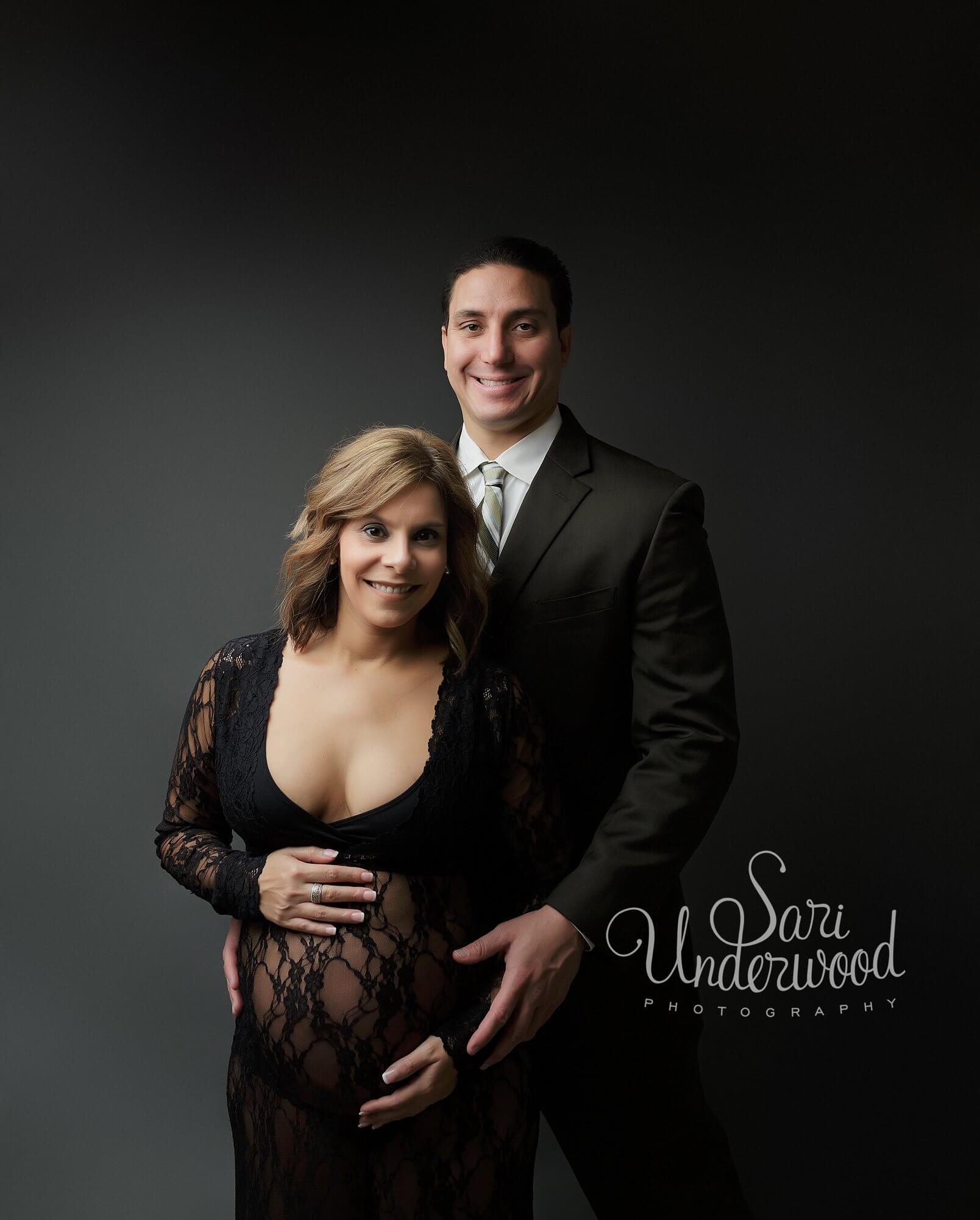First time parents posing for maternity portraits Orlando